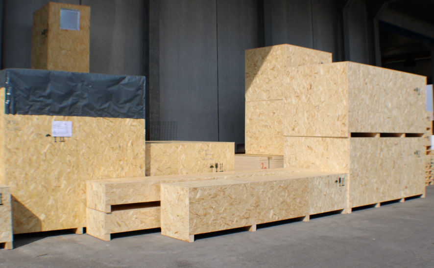A variety of wood cases made from OSB viewed from warehouse lot