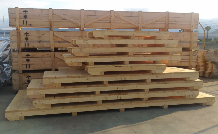Large stack of a variety of wooden bases for industrial shipping